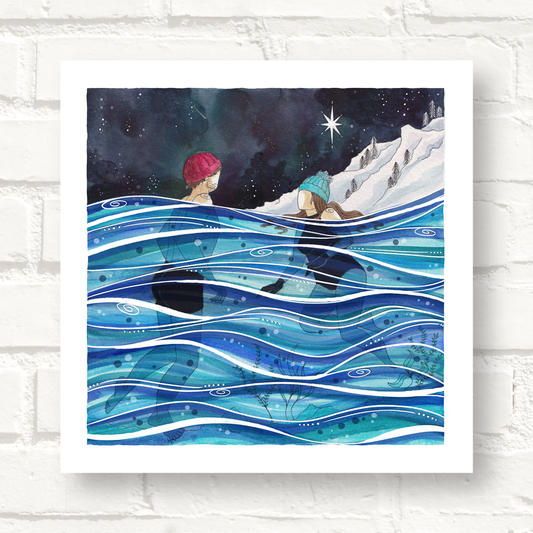 Man and Woman swimming in the ocean under the North Star